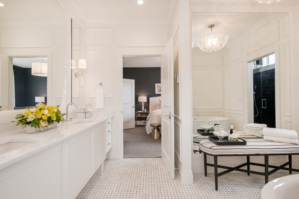 Large transitional master multicolored tile and mosaic tile mosaic tile floor freestanding bathtub photo in Calgary with raised-panel cabinets, white cabinets, quartz countertops, an undermount sink, a one-piece toilet and white walls