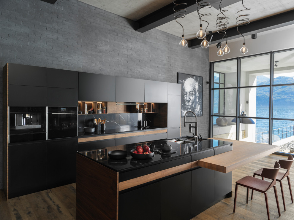 Design ideas for a mid-sized contemporary galley kitchen in Saint Petersburg with black appliances, with island, an undermount sink, flat-panel cabinets, white cabinets, black splashback, medium hardwood floors, brown floor and black benchtop.