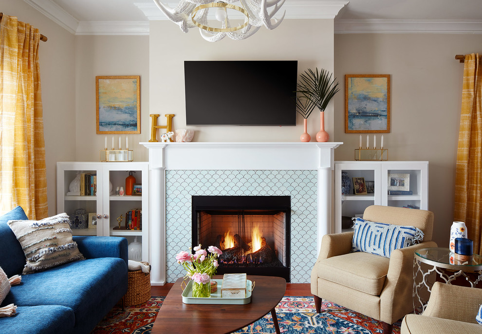 Inspiration for a contemporary living room in Chicago with beige walls, medium hardwood floors, a standard fireplace, a tile fireplace surround, a wall-mounted tv and brown floor.
