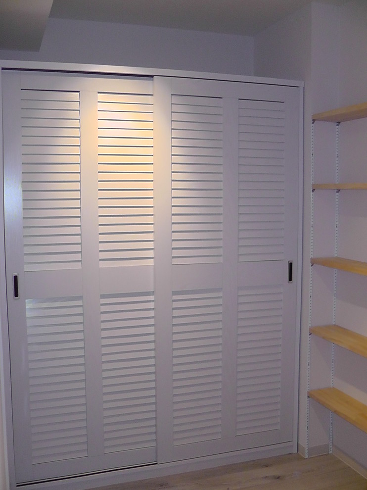 Design ideas for a large transitional storage and wardrobe in Other.