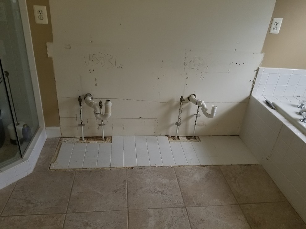 False wall to hide bathroom plumbing