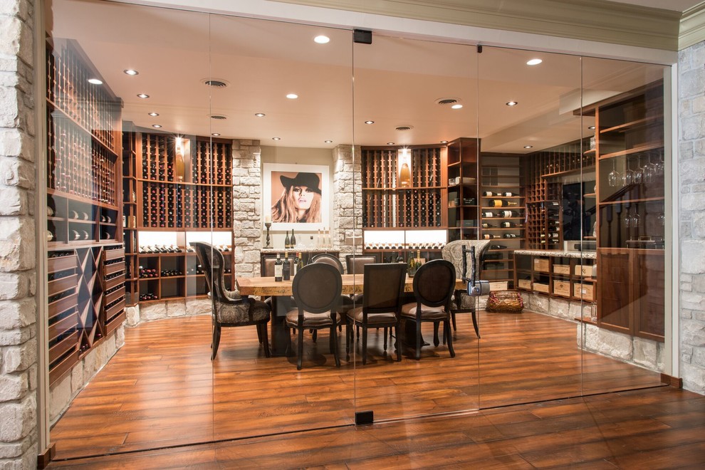 Photo of a large traditional wine cellar in St Louis with medium hardwood floors and storage racks.