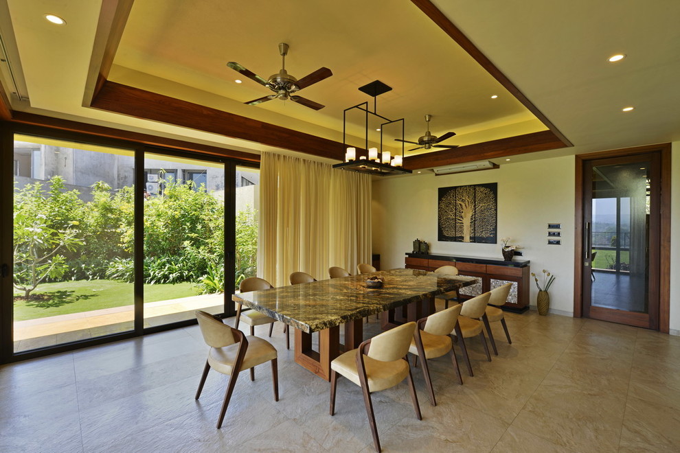 Inspiration for a contemporary dining room in Mumbai.
