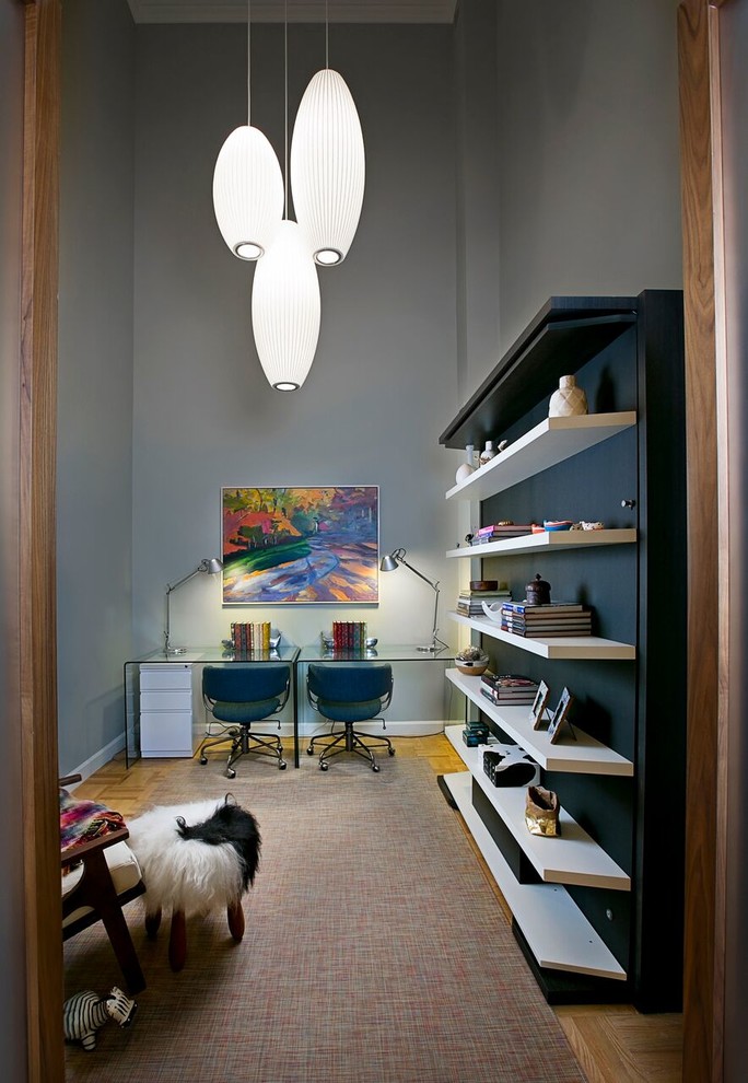 Photo of a mid-sized transitional study room in New York with carpet, no fireplace, a freestanding desk and grey walls.