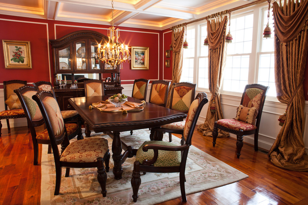 This is an example of a large eclectic separate dining room in Boston with red walls and dark hardwood floors.