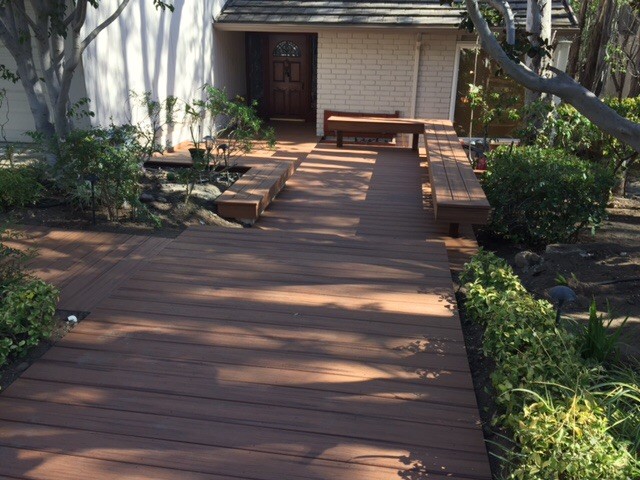 Example of a large mountain style backyard balcony deck design in Los Angeles with a pergola