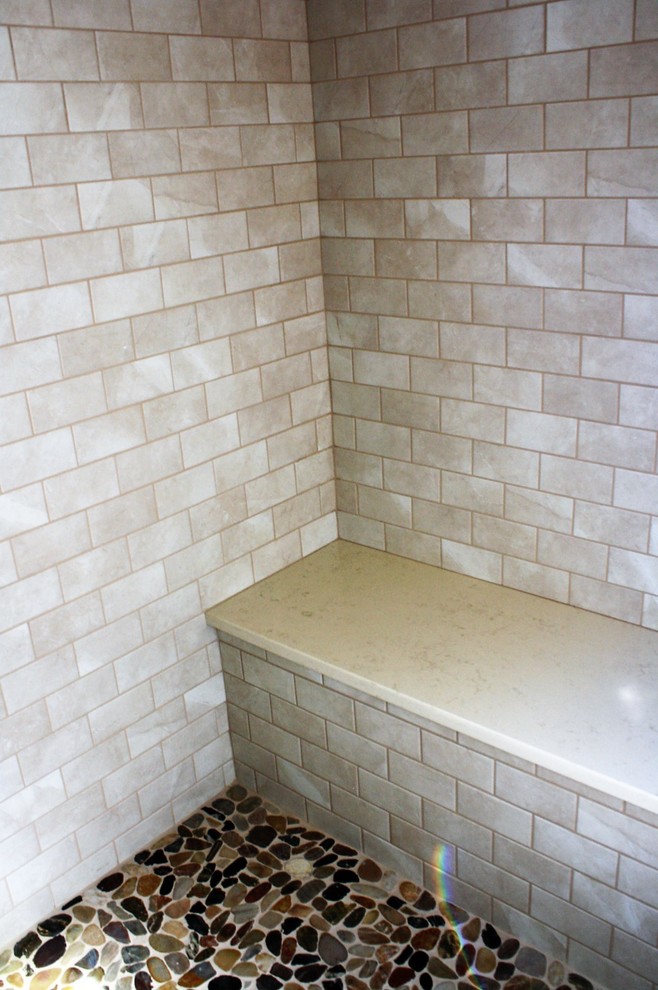 Home design - large rustic master brown floor home design idea with an undermount tub and quartz countertops