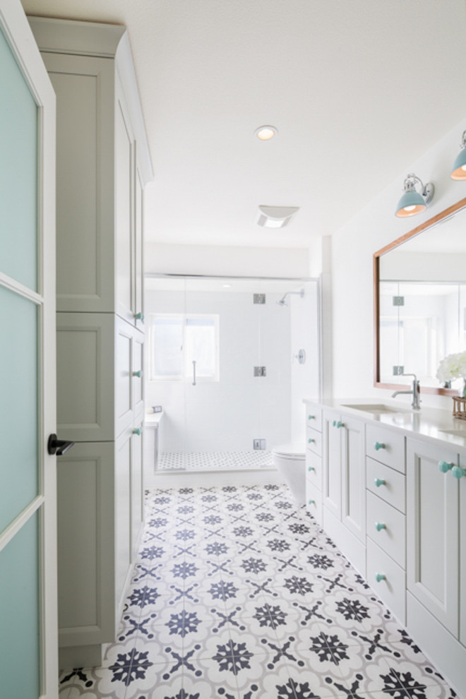 Mid-sized country kids bathroom in Denver with shaker cabinets, grey cabinets, an alcove shower, a two-piece toilet, multi-coloured tile, cement tile, white walls, cement tiles, an undermount sink and engineered quartz benchtops.