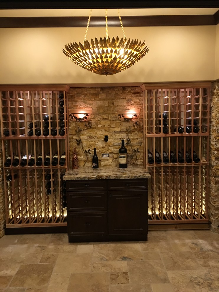 Photo of an expansive contemporary wine cellar in Phoenix with limestone floors and storage racks.