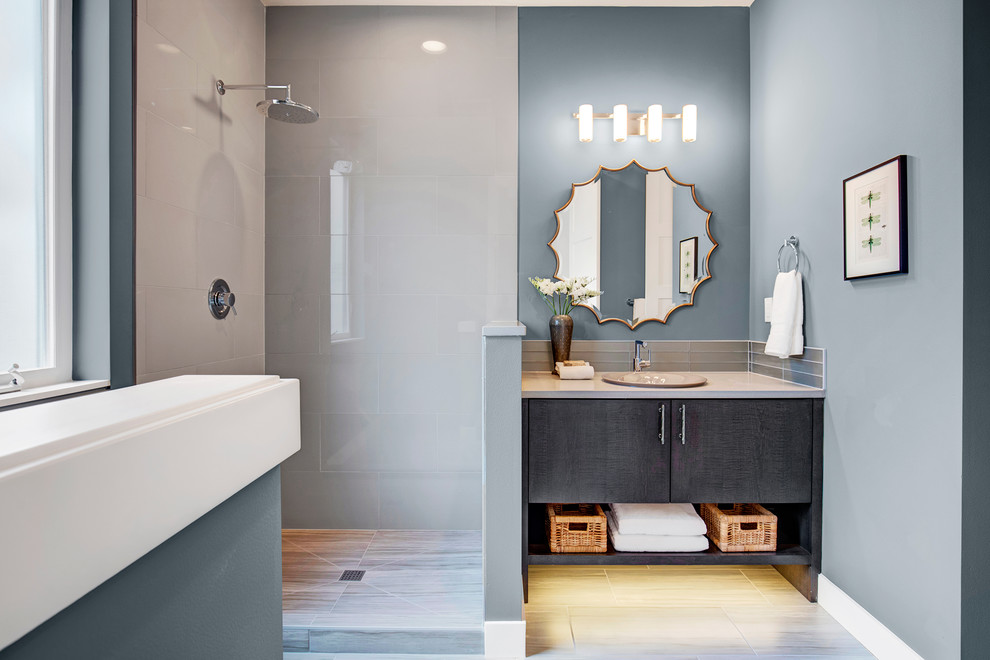 Contemporary 3/4 bathroom in Seattle with furniture-like cabinets, brown cabinets, a corner shower, glass tile, porcelain floors, quartzite benchtops, a hinged shower door, a one-piece toilet and an undermount sink.