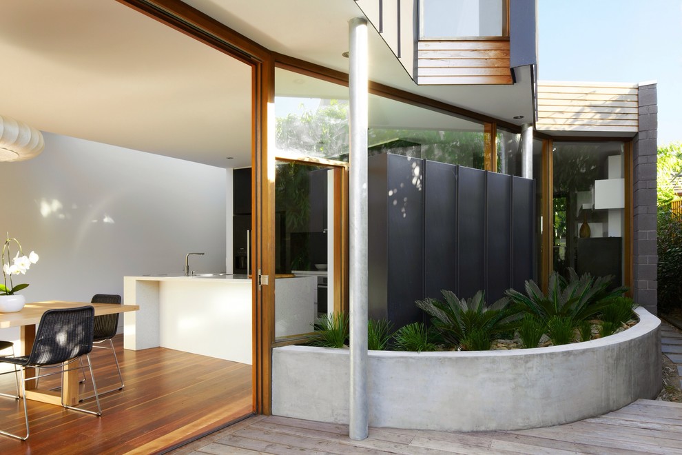 Photo of a contemporary exterior in Melbourne with wood siding.