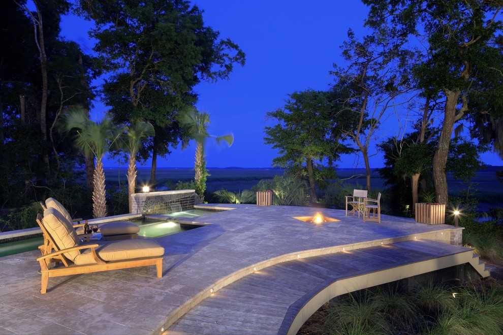 Large contemporary backyard patio in Atlanta with a fire feature, natural stone pavers and no cover.
