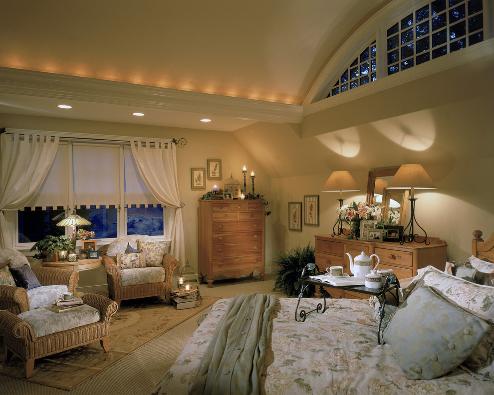 This is an example of a traditional bedroom in New York with beige walls and carpet.