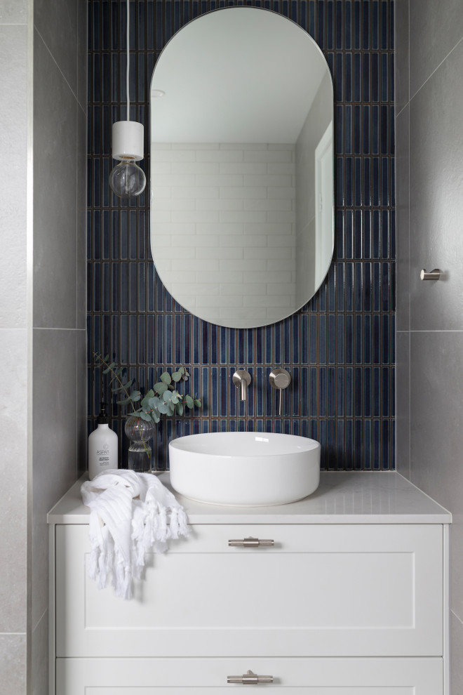 Minimalist white tile and subway tile porcelain tile bathroom photo in Canberra - Queanbeyan with shaker cabinets, white cabinets, a one-piece toilet, a vessel sink, quartz countertops and white countertops