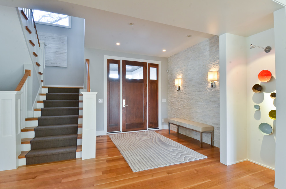 Inspiration for a contemporary foyer in Minneapolis with grey walls, a single front door and a dark wood front door.