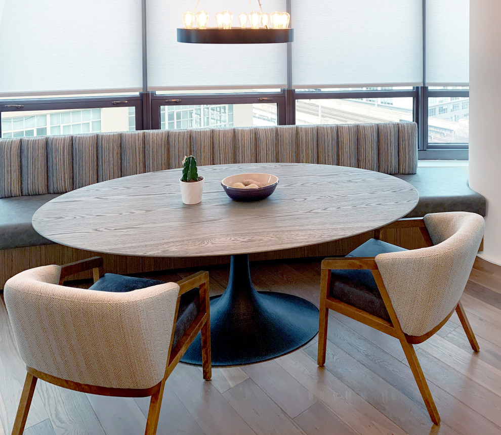 Inspiration for a small modern dining room in Philadelphia with medium hardwood flooring.