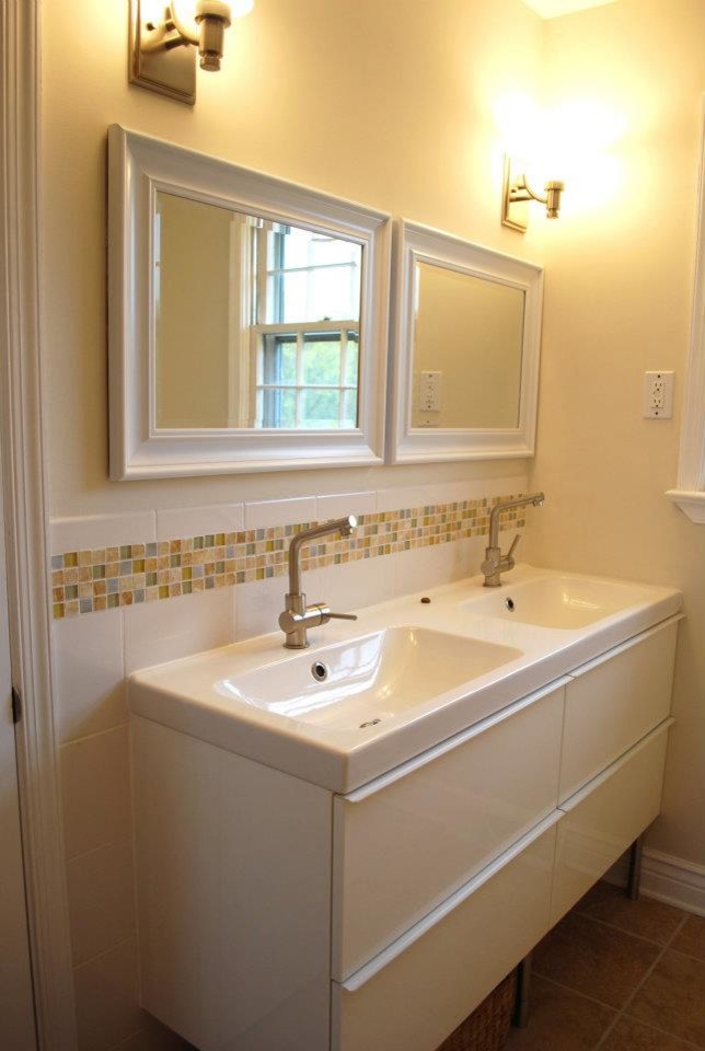 Mid-sized modern kids bathroom in Philadelphia with an integrated sink, white cabinets, solid surface benchtops, yellow tile, ceramic tile, yellow walls and ceramic floors.