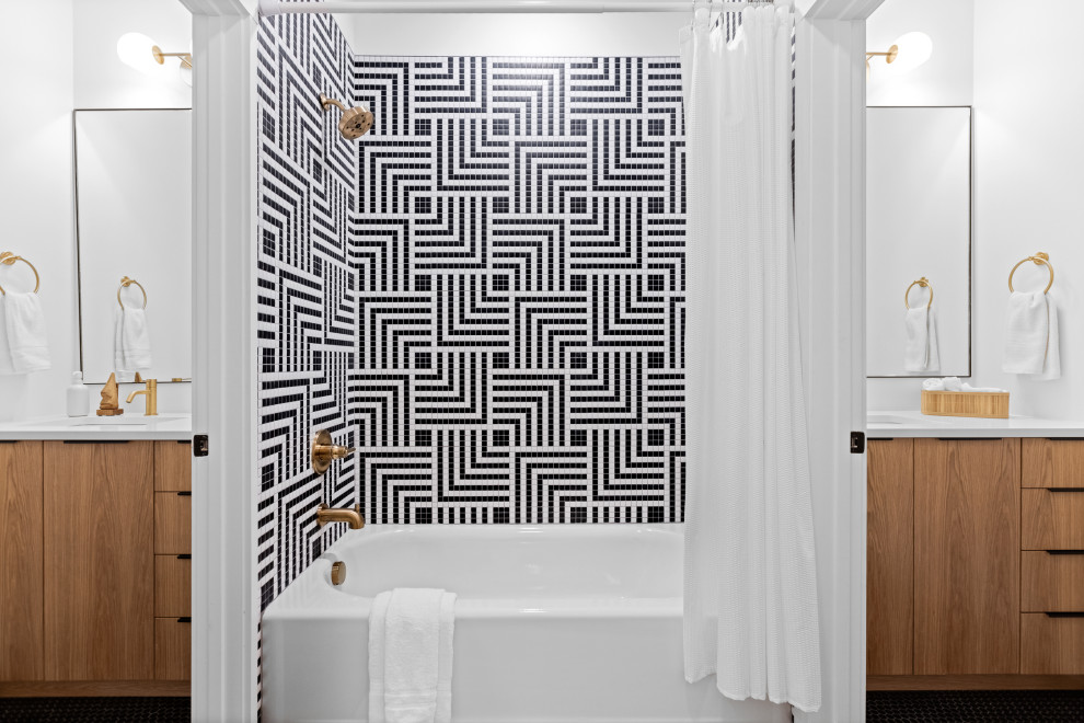 This is an example of a contemporary bathroom in Other with flat-panel cabinets, medium wood cabinets, black and white tile, white walls, an undermount sink, black floor, white benchtops, a double vanity and a built-in vanity.
