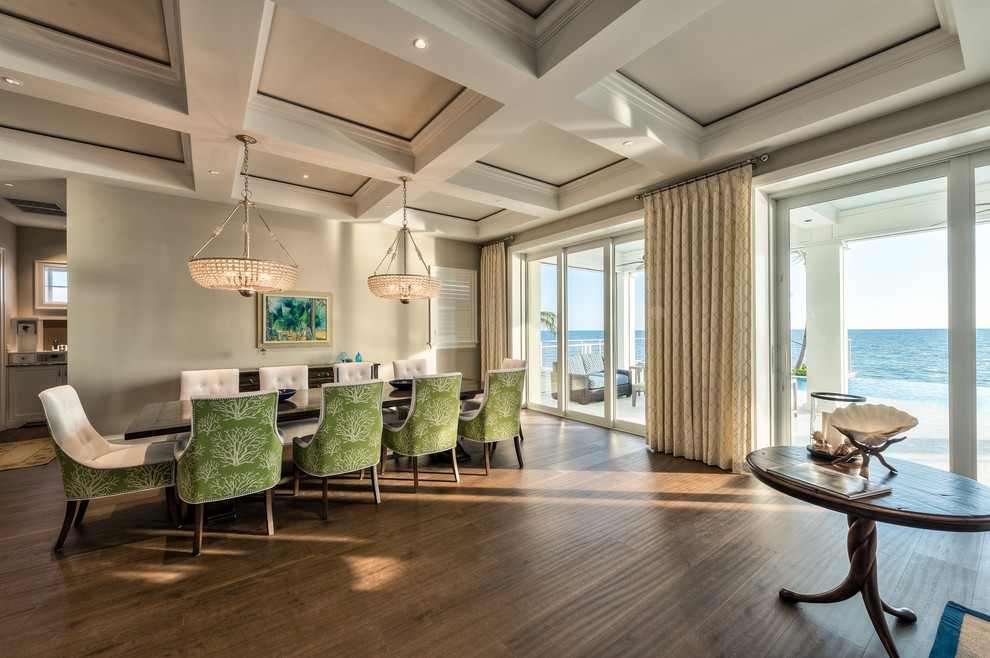 Inspiration for a large beach style open plan dining in Miami with medium hardwood floors.