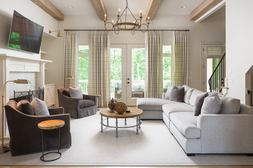 Inspiration for a mid-sized country formal open concept living room in Atlanta with beige walls, medium hardwood floors, a standard fireplace, a wall-mounted tv, brown floor and a tile fireplace surround.