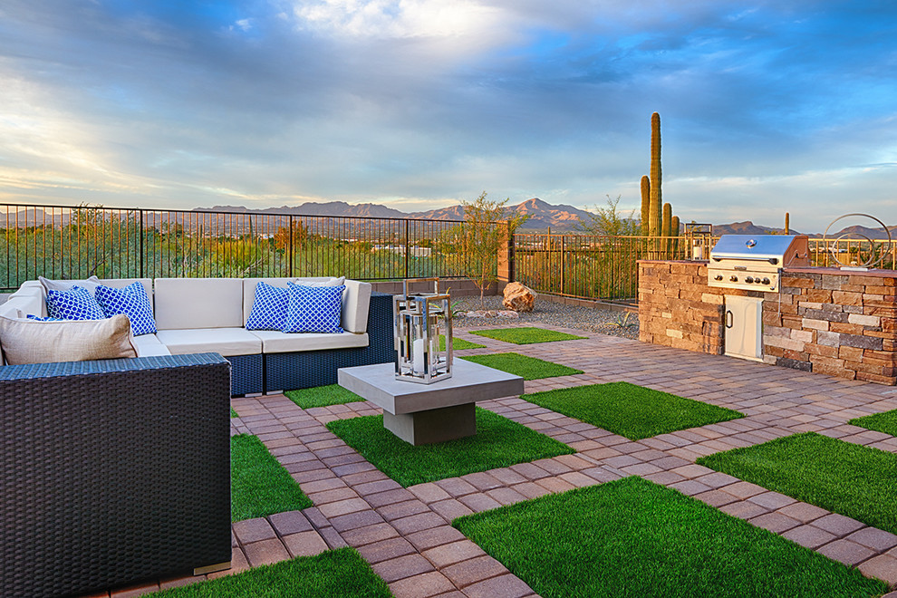 This is an example of a contemporary backyard patio in Denver.