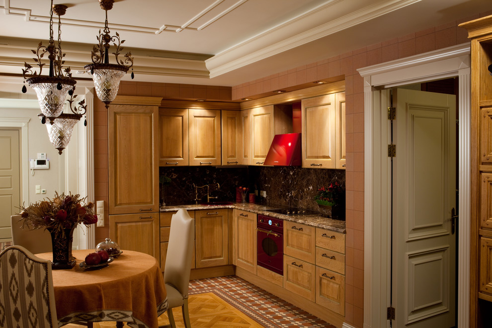 Traditional l-shaped eat-in kitchen in Moscow with medium wood cabinets, marble benchtops, brown splashback, stone slab splashback, panelled appliances, ceramic floors and no island.