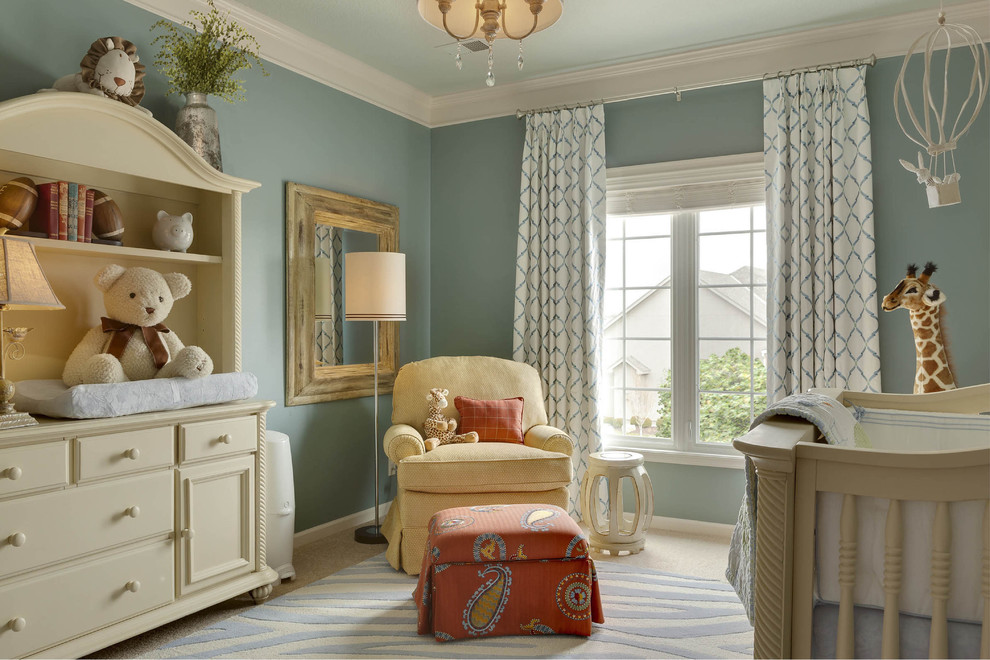 This is an example of a mid-sized traditional gender-neutral nursery in Kansas City with blue walls and carpet.