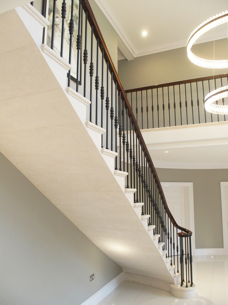 Inspiration for a contemporary straight metal railing staircase in Other with limestone treads and limestone risers.