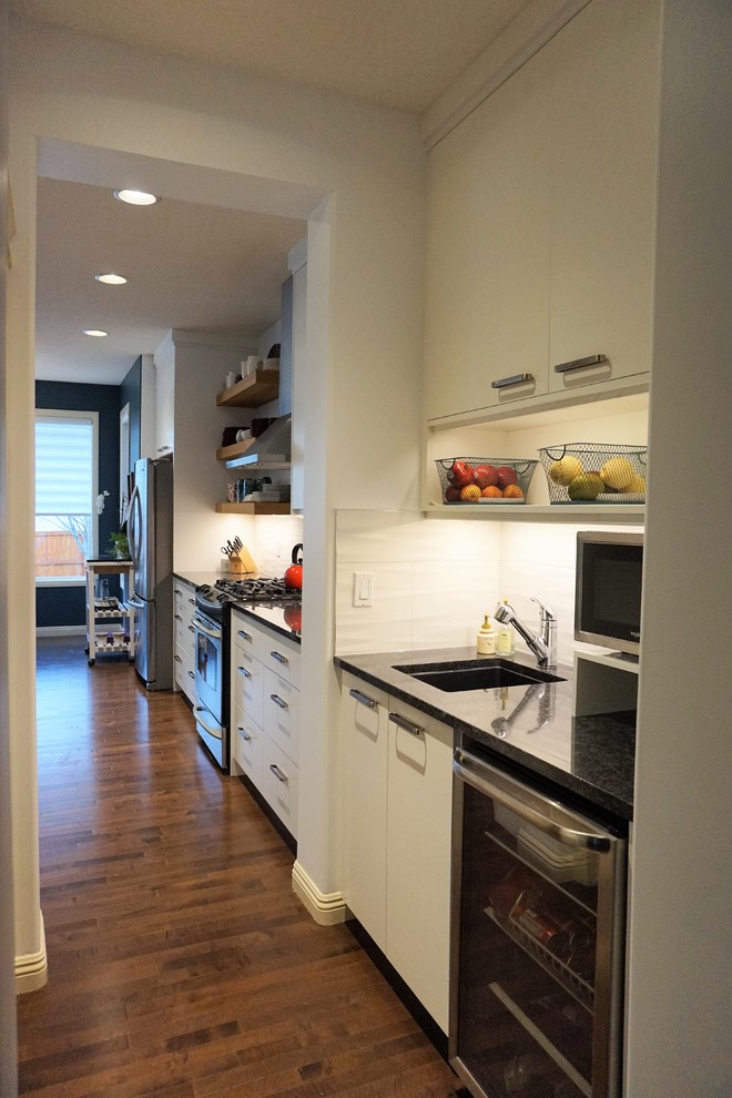 Example of a transitional kitchen design in Calgary