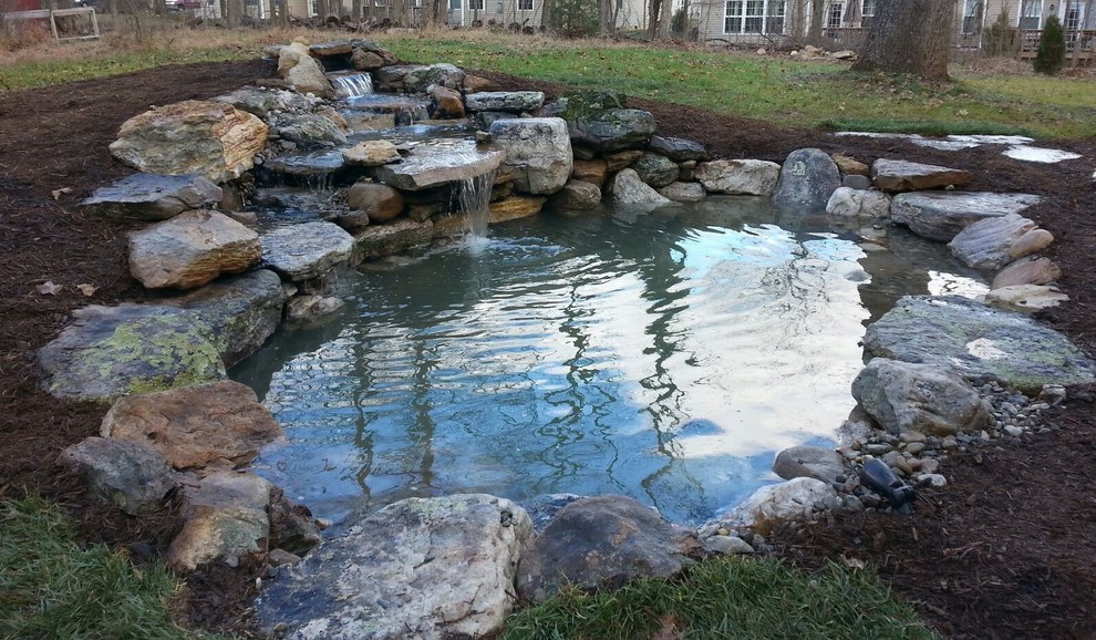 Inspiration for a country backyard garden in Baltimore with a water feature.