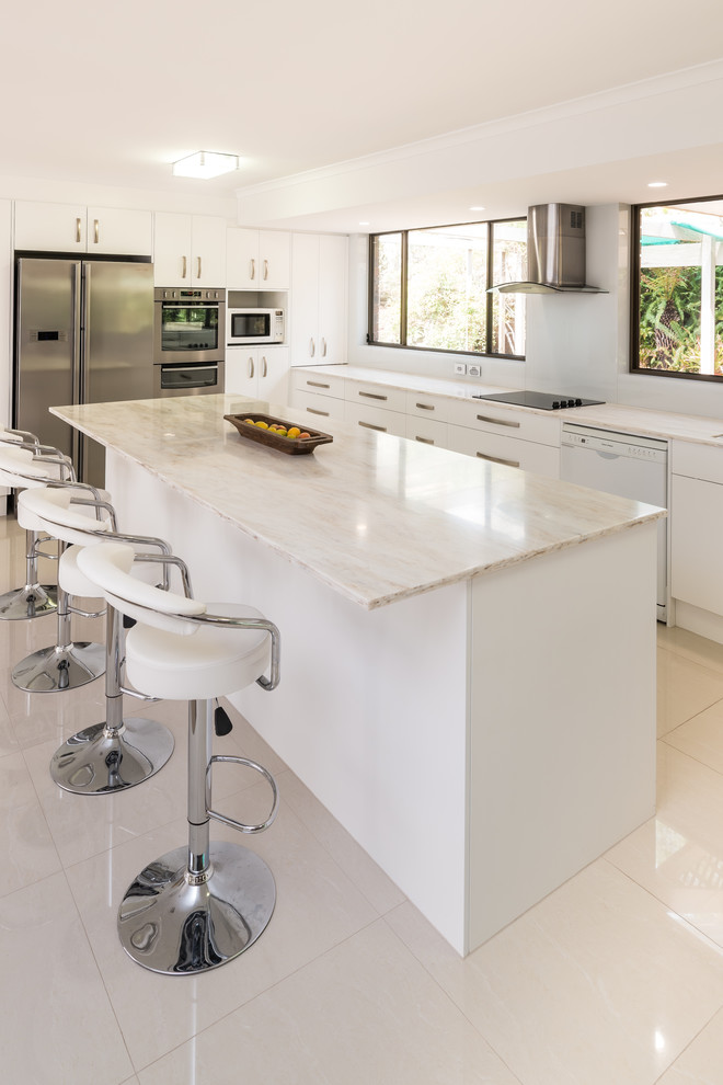 Design ideas for a large contemporary eat-in kitchen in Other with an undermount sink, white cabinets, white splashback, glass sheet splashback, stainless steel appliances, porcelain floors, with island and solid surface benchtops.