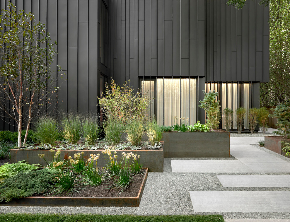 Inspiration for a contemporary full sun garden in Chicago with gravel.