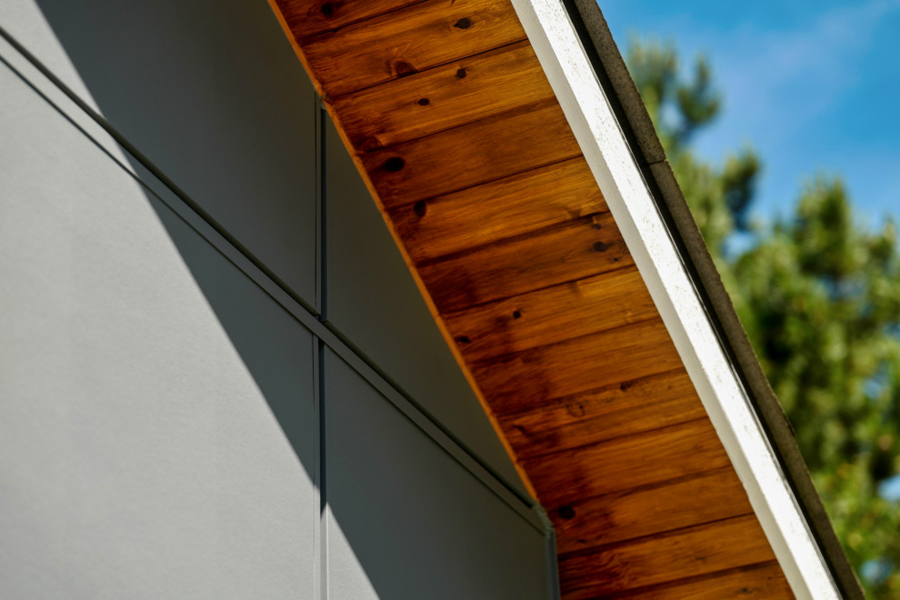 Staircase - mid-sized transitional two-story mixed siding staircase idea in Seattle