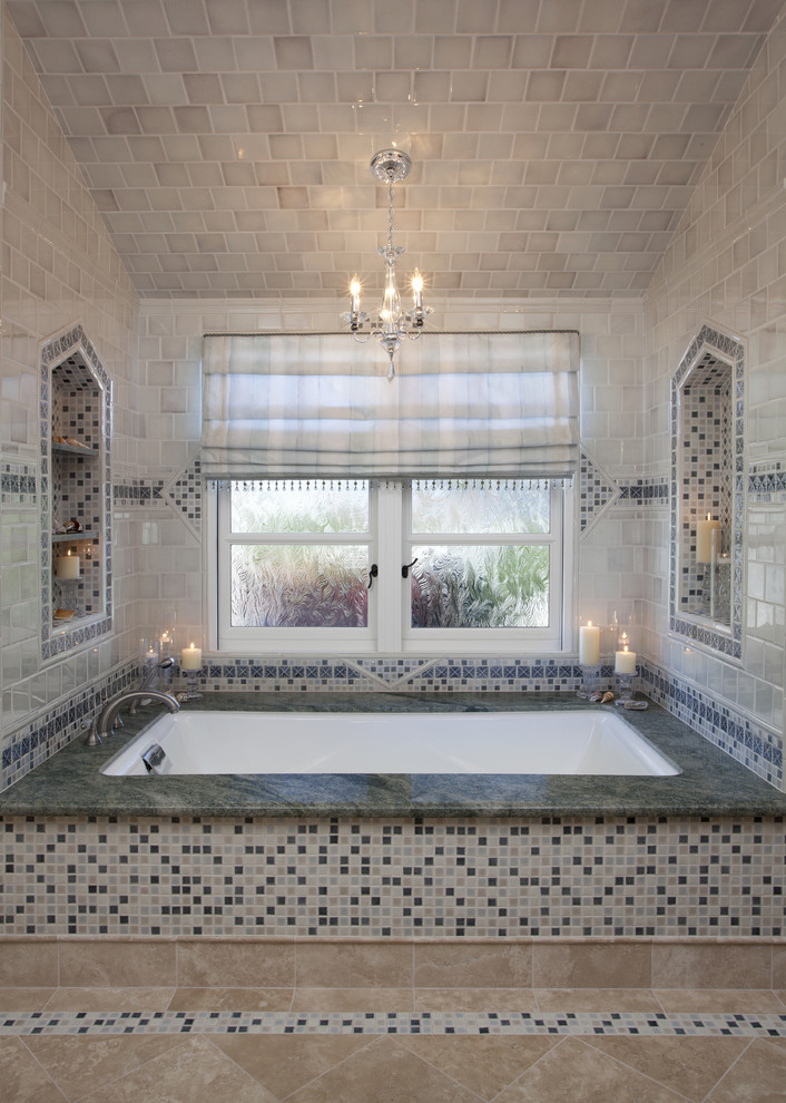 Large traditional master bathroom in San Francisco with an undermount tub, multi-coloured tile, mosaic tile, raised-panel cabinets, dark wood cabinets, a corner shower, beige walls, porcelain floors, an undermount sink, granite benchtops, beige floor, a hinged shower door and green benchtops.