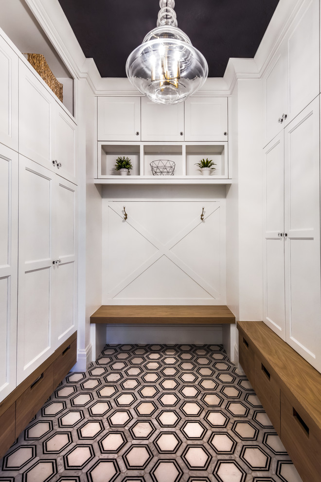 Inspiration for a traditional mudroom in Salt Lake City with white walls and multi-coloured floor.
