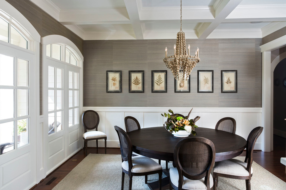 This is an example of a transitional separate dining room in Charlotte with grey walls and dark hardwood floors.