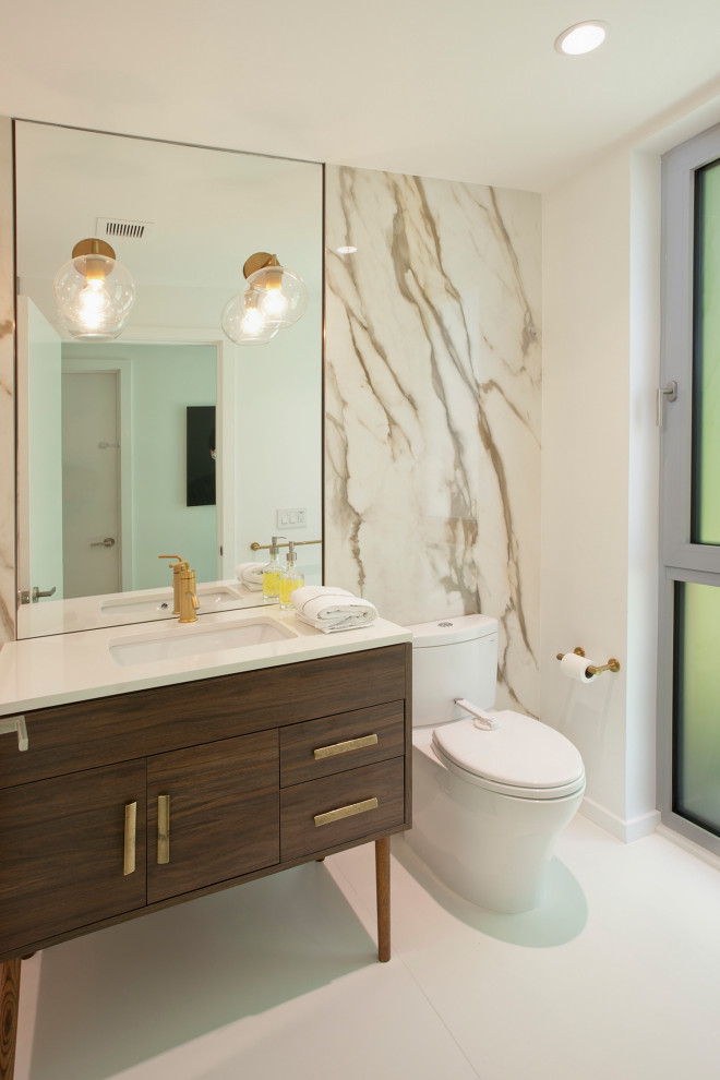 Photo of a mid-sized midcentury 3/4 bathroom in New York with flat-panel cabinets, brown cabinets, a curbless shower, white tile, porcelain tile, white walls, porcelain floors, an undermount sink, engineered quartz benchtops, white floor, a sliding shower screen, white benchtops, a single vanity and a freestanding vanity.