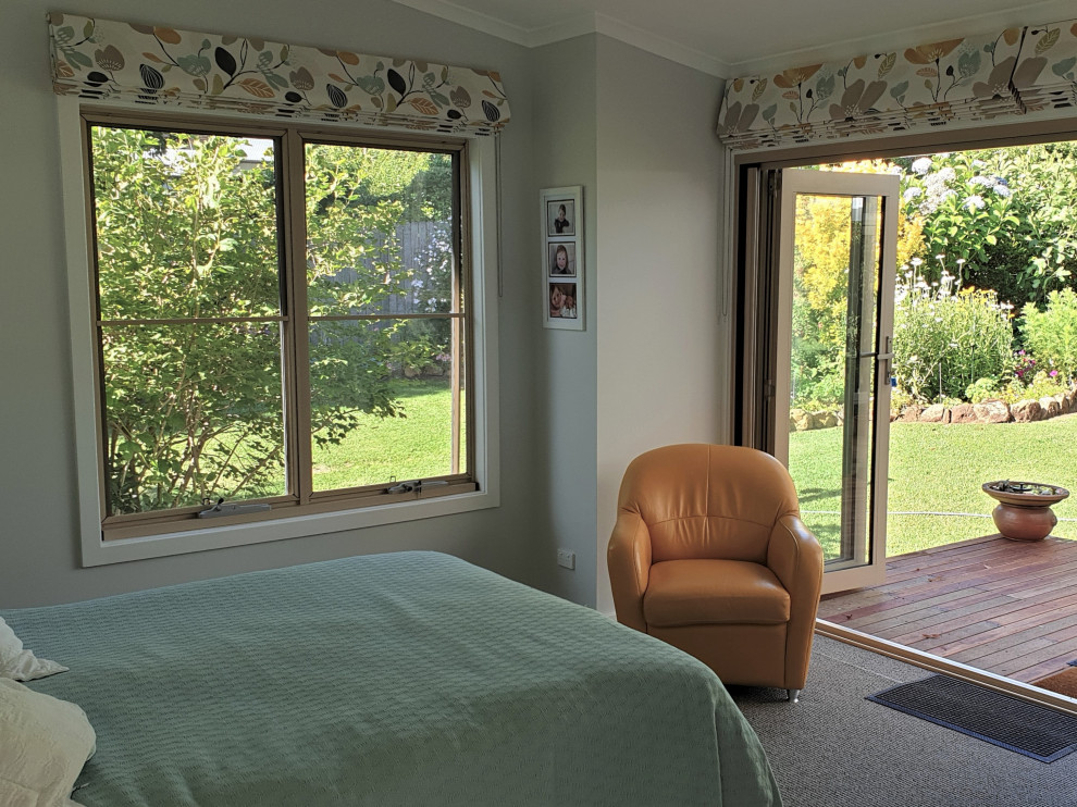 This is an example of a midcentury bedroom in Other.