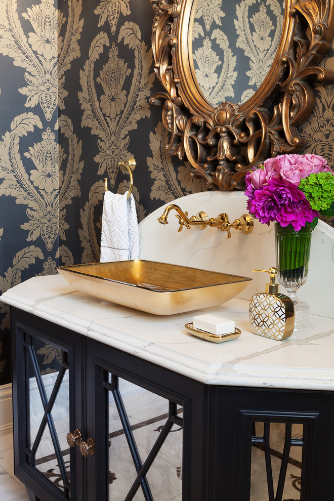 Photo of a large traditional powder room in Toronto with black cabinets, a one-piece toilet, mosaic tile, marble floors, a vessel sink, marble benchtops, multi-coloured walls, white tile and recessed-panel cabinets.