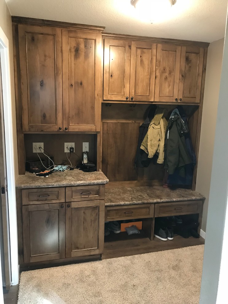Example of a small classic beige floor mudroom design with gray walls