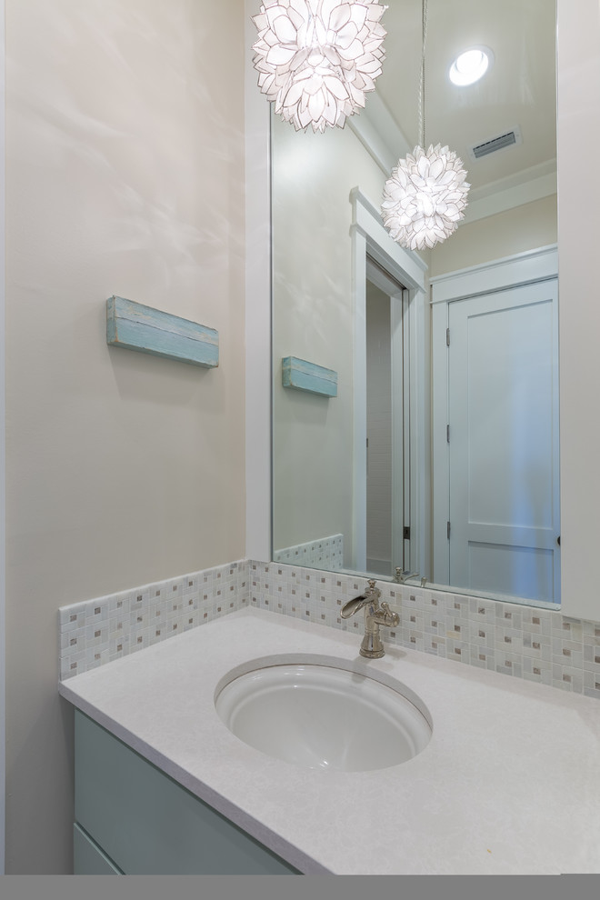 Design ideas for a mid-sized transitional 3/4 bathroom in Jacksonville with flat-panel cabinets, grey cabinets, an alcove shower, a two-piece toilet, subway tile, white walls, ceramic floors, a wall-mount sink, beige tile, yellow tile and engineered quartz benchtops.