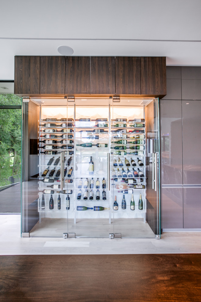 Inspiration for a modern wine cellar in Dallas with display racks.