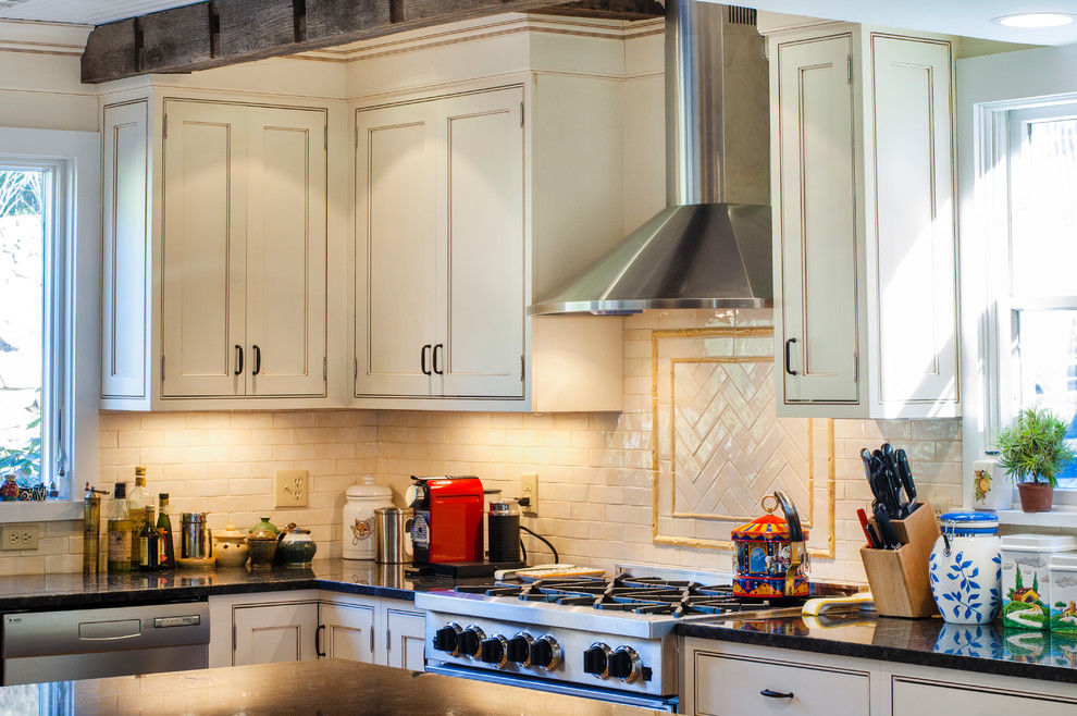 Inspiration for a transitional u-shaped medium tone wood floor kitchen remodel in New York with a farmhouse sink, beaded inset cabinets, white cabinets, granite countertops, beige backsplash, subway tile backsplash, stainless steel appliances and an island