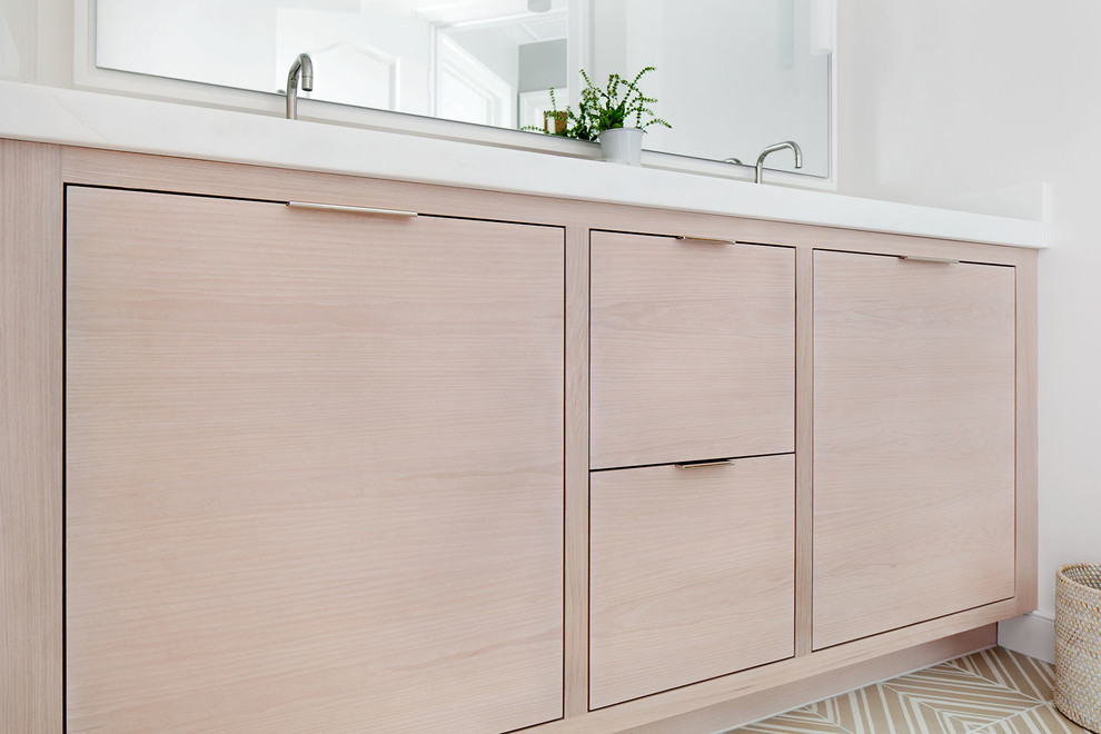 Mid-sized transitional master beige floor bathroom photo in DC Metro with light wood cabinets, white walls, marble countertops, white countertops and an undermount sink