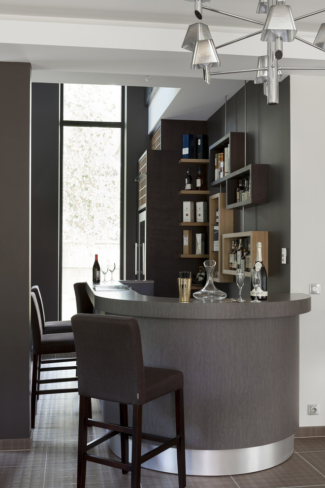 Photo of a large contemporary seated home bar in Other.