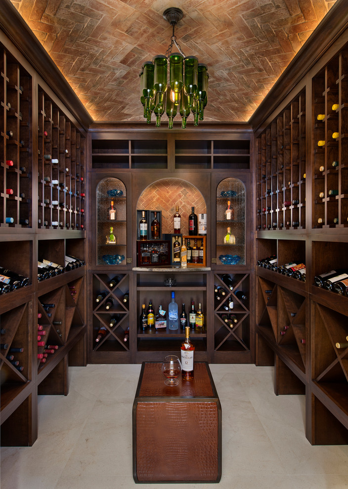 Inspiration for an expansive mediterranean wine cellar in Miami with marble floors, storage racks and beige floor.