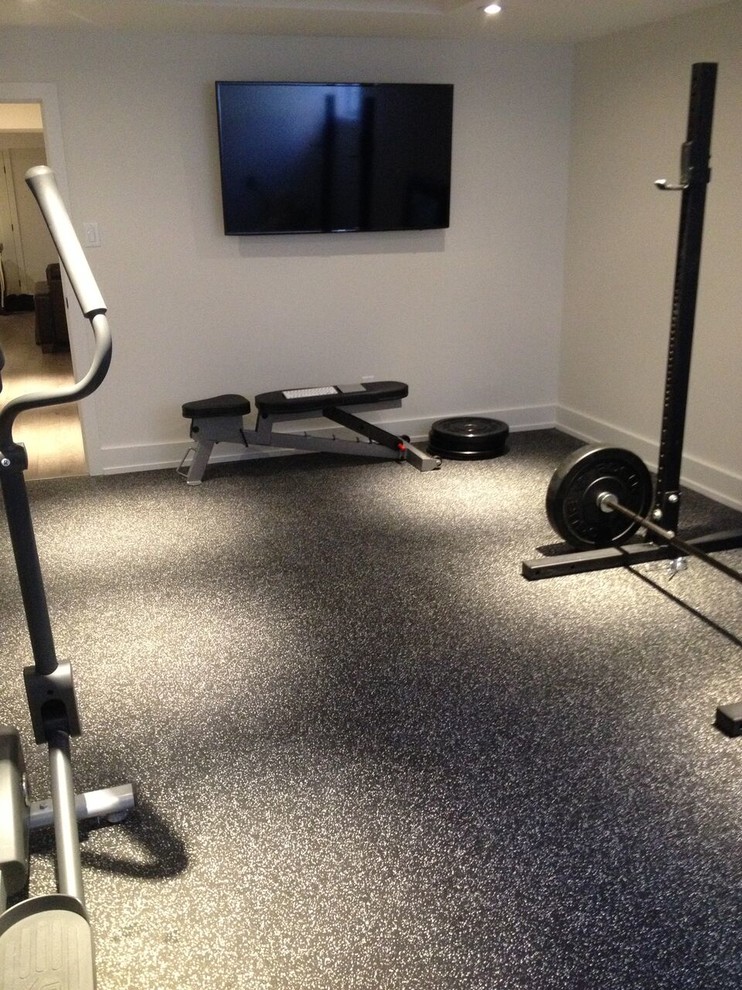 Design ideas for a large transitional home weight room in Toronto with white walls.