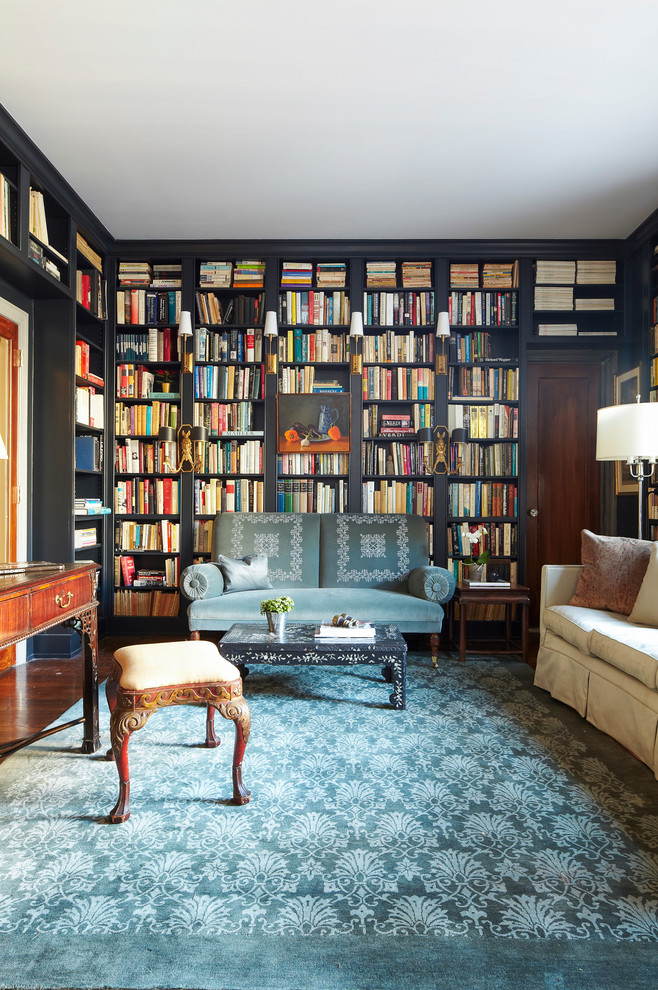 This is an example of an eclectic family room in New York with a library.