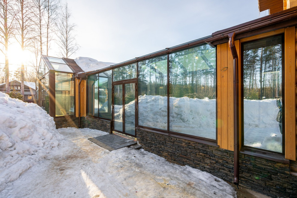 Строительство загородного дома с зимним садом с электрохромными стеклами перемен