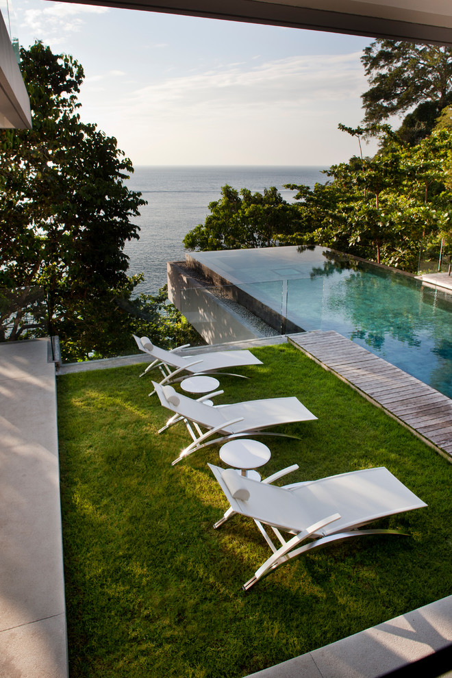 Inspiration for a mid-sized modern backyard rectangular infinity pool remodel in Boston
